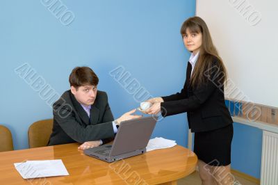 Secretary gives a cup to the chief