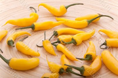 Yellow chilli in the wood plate