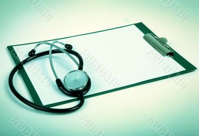 blank clipboard with stethoscope