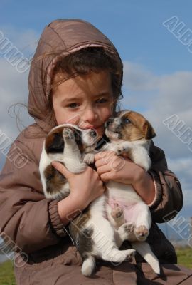 sad little girl and puppies