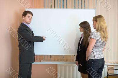 Office workers discuss work