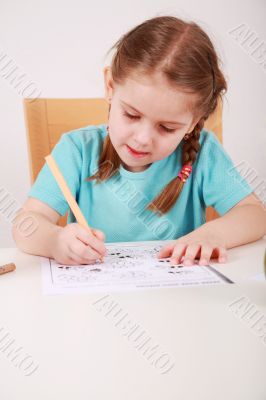 Cute little girl painting