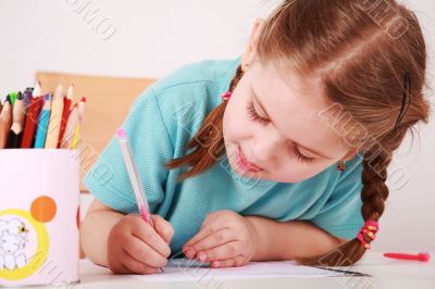 Cute little girl painting