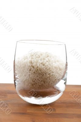 coarse grey sea salt in glass
