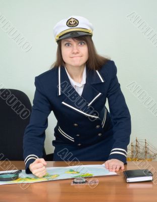 Girl in the form of captain punches a table