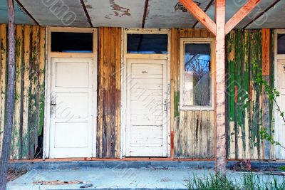 old wooden doors abandoned house