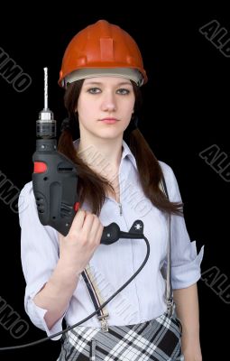 Beautiful girl in a protective helmet with a drill