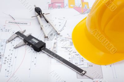 Building plan with safety helmet Building plan with safety helmet
