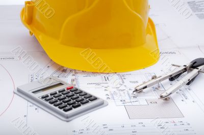 Building plan with safety helmet