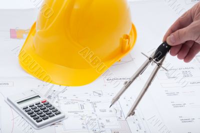 Building plan with safety helmet Building plan with safety helmet