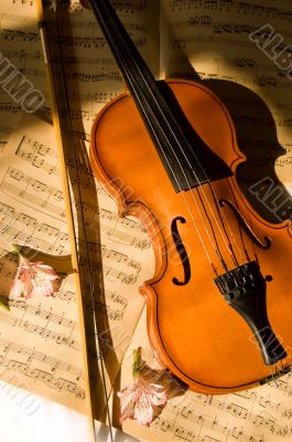 Old violin, fiddle-stick and music sheet Old violin, fiddle-stick and music sheet