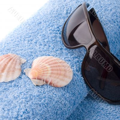 towel, shells, sunglasses towel, shells, sunglasses