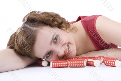 Smiley woman with hair-rollers.