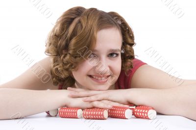 Woman with curlers in her hair.