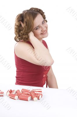 Woman with curlers in her hair.