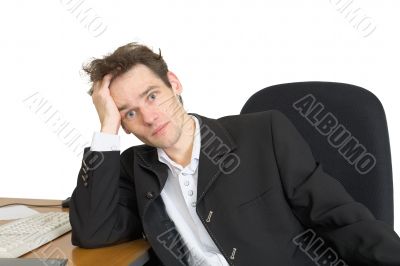 Sorrowful businessman on a workplace