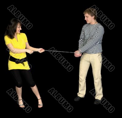 Young girl conducts on a chain of the guy Young girl conducts on a chain of the guy