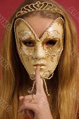 young woman in mask shows gesture of silence young woman in mask shows gesture of silence