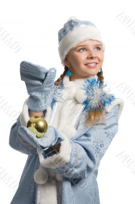 Snow maiden with christmas-tree decoration looks upward Snow maiden with christmas-tree decoration looks upward
