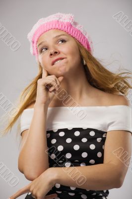 beautiful thoughtful girl in pink beret