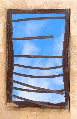 Old window closed by rusty lattice