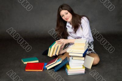 Schoolgirl with the big heap of books Schoolgirl with the big heap of books