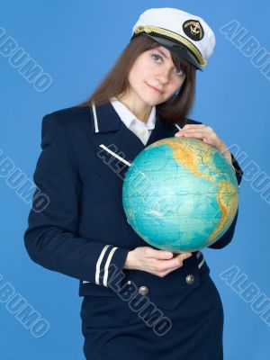 Woman in sea uniform and globe