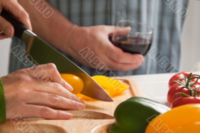 Woman Slicing Vegetables on Cutting Board