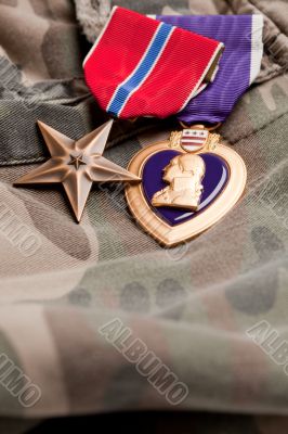 Bronze and Purple Heart Medals on Camouflage Material