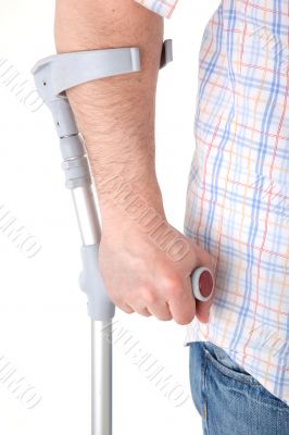 man walking with a crutch