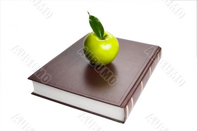 Books and green apple