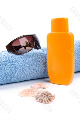 towel, sunglasses and lotion