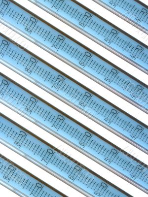 close-up mercury thermometers over white background