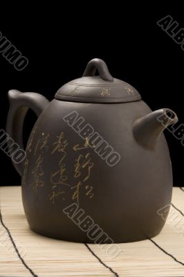 teapot on mat