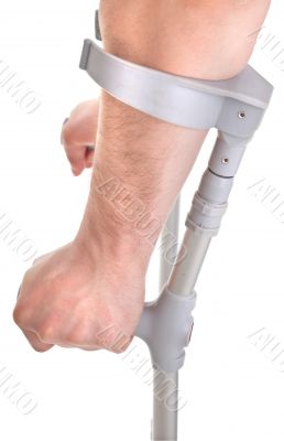 hands holding crutch