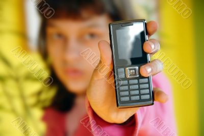 Teen girl showing her mobile phone