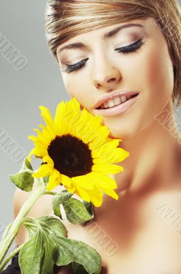 Beautiful woman with a sunflower