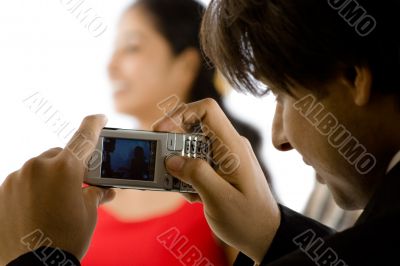 photograph of  girl with cellphone camera