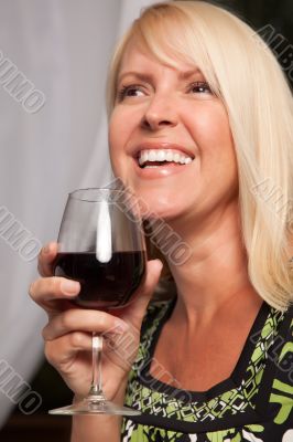 Beautiful Blonde Enjoying Wine