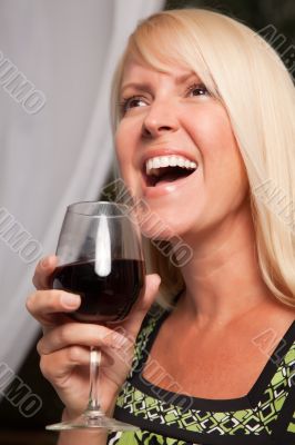 Beautiful Blonde Enjoying Wine