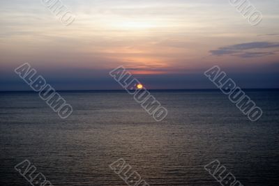 Sunset at coast of Pacific ocean