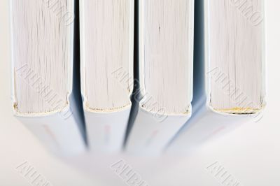 Backs of four books