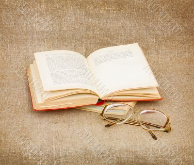 Still-life from eyeglasses and book