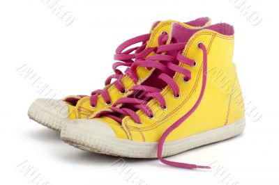 yellow shoes with pink shoelace