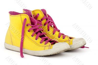 yellow shoes with pink shoelace