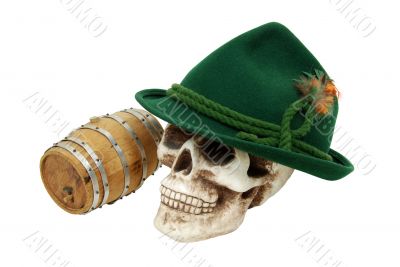 Alpine hat on skull next to an oak barrel