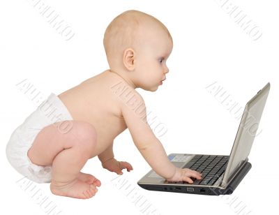 Baby on a white background with laptop