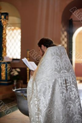 Priest with Bible