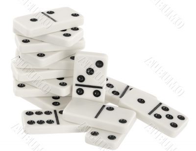 Heap of bones of dominoes on a white
