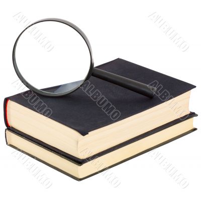Still-life from a magnifier and a pile of old books Still-life from a magnifier and a pile of old books